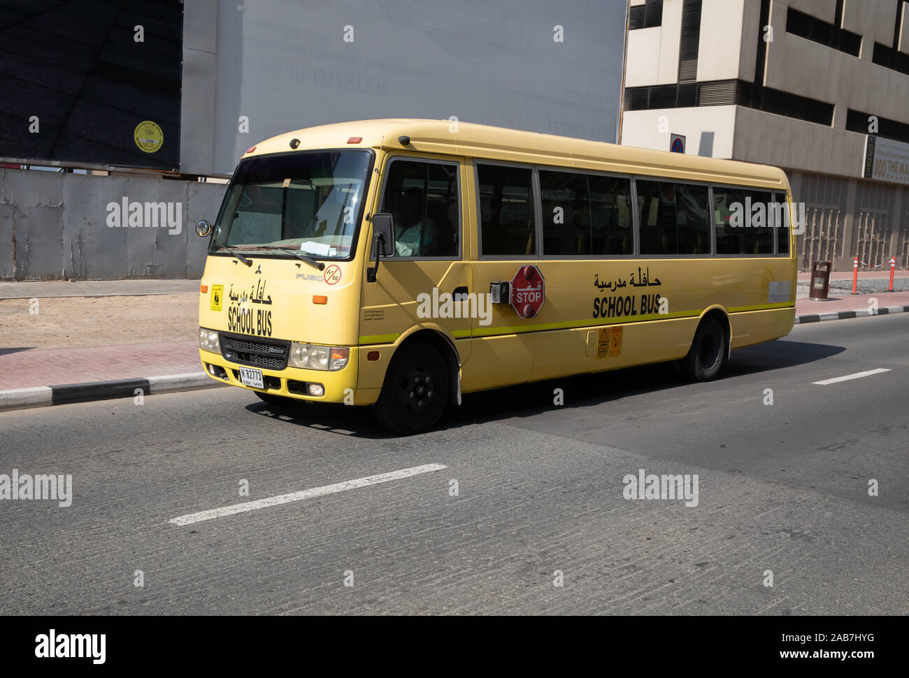 Yellow school bus in Dubai's Financial District, UAE Stock Photo Alamy
