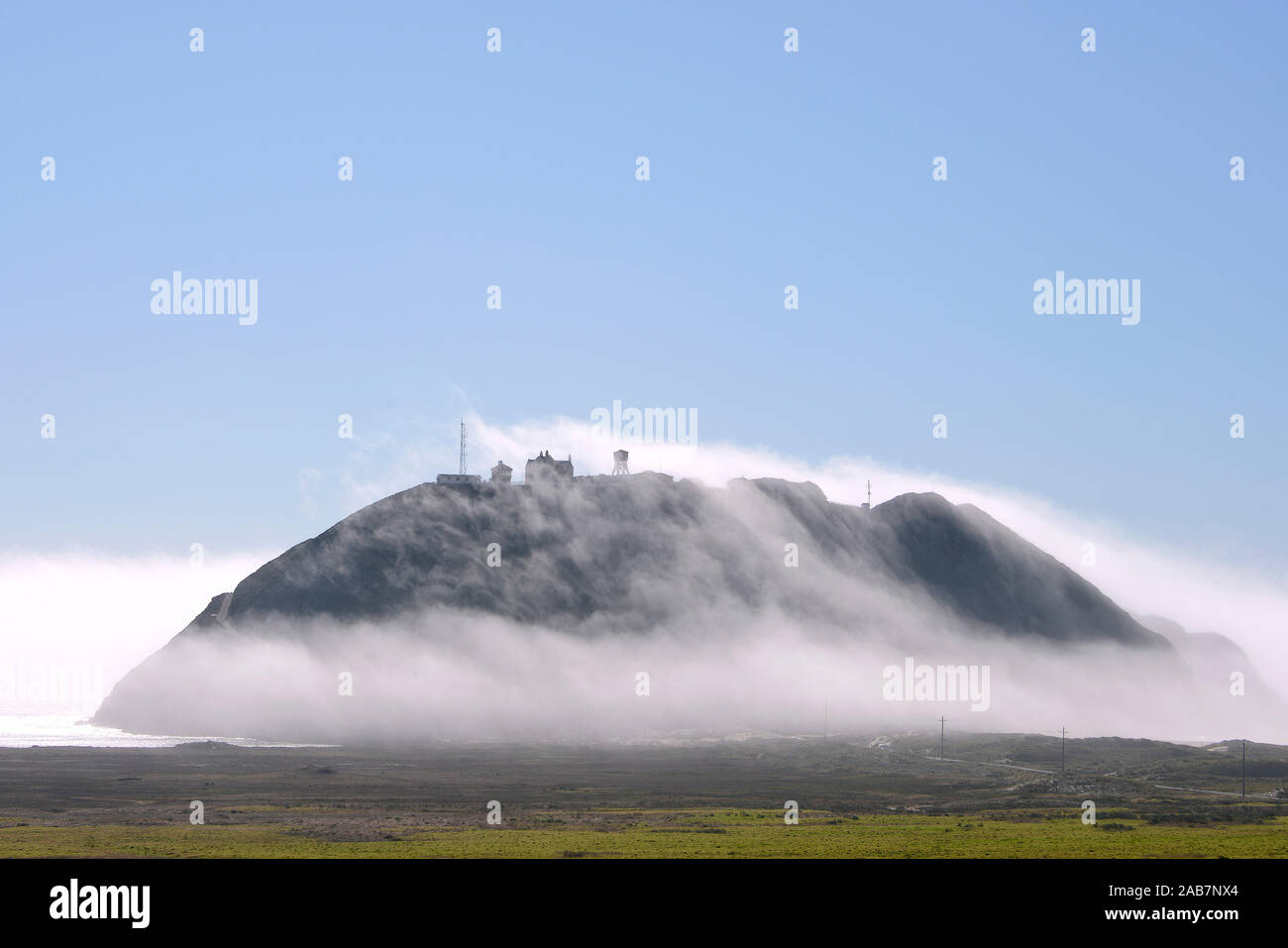 Fog over Point Sur, Peninsula on California State Route 1, Highway 1, coastal road along the Pacific Ocean, California, USA Stock Photo