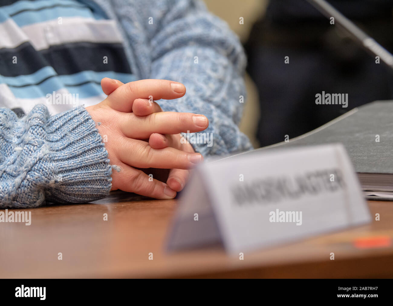 Munich, Germany. 26th Nov, 2019. The defendant is sitting in his place in court at the start of the trial. The auxiliary nurse is being tried for the murder of at least six patients. Credit: Peter Kneffel/dpa/Alamy Live News Stock Photo