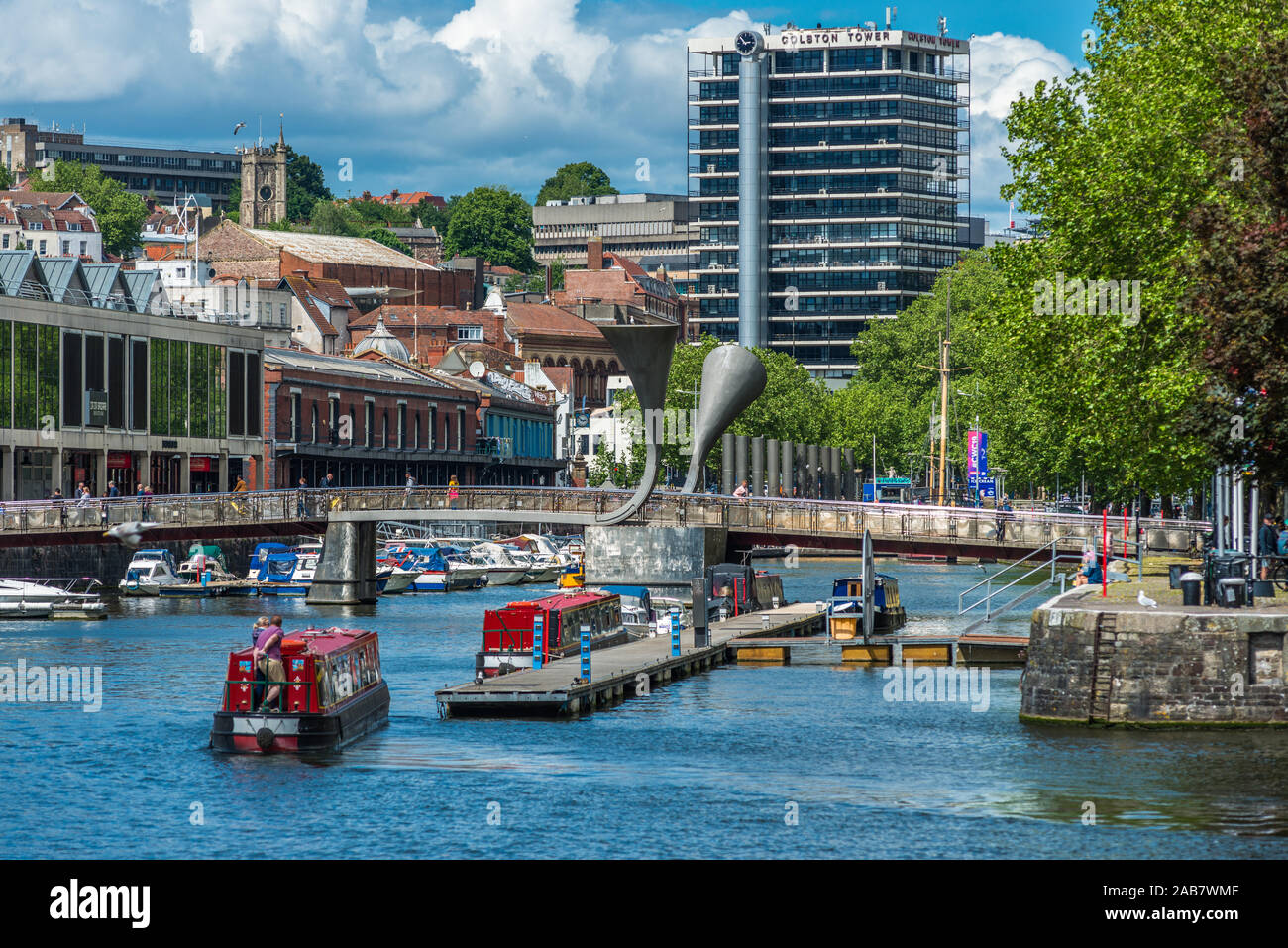 City skyline with canal boats at Pero's Bridge across the Floating Harbour, Harbourside, Bristol, England, United Kingdom, Europe Stock Photo