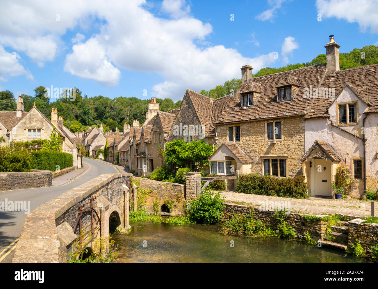Water Lane with bridge over By Brook on to The Street, Castle Combe village, Castle Combe, Cotswolds, Wiltshire, England, United Kingdom, Europe Stock Photo