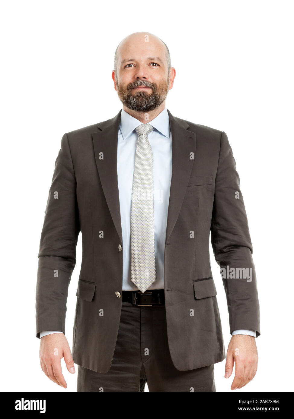 Ein tuechtiger Geschaeftsmann im Anzug vor weissem Hintergrund Stock Photo