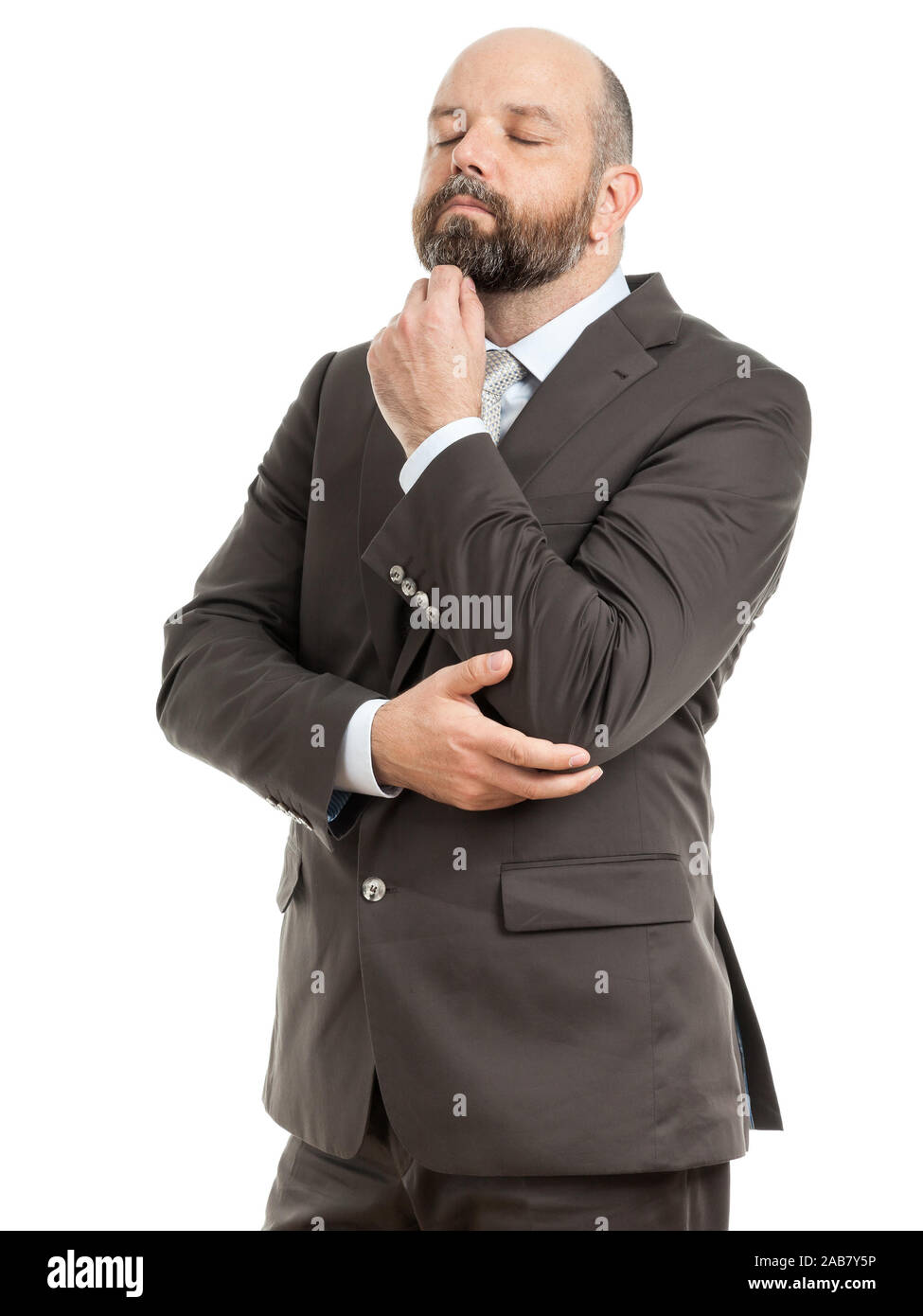Ein motivierter Geschaeftsmann vor weissem Hintergrund Stock Photo