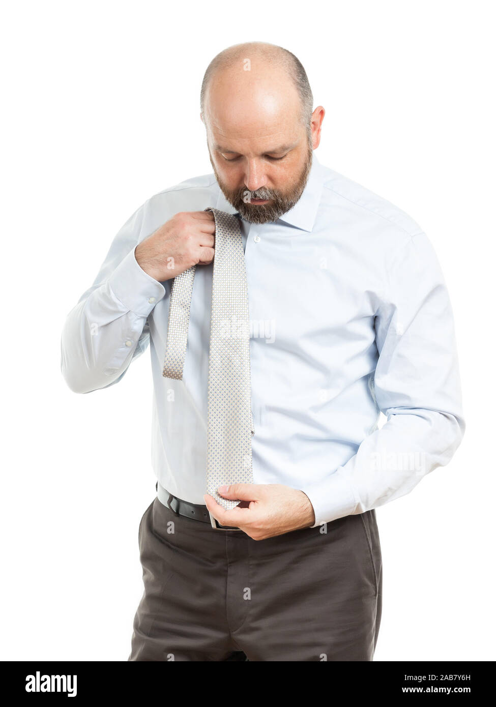 Ein motivierter Geschaeftsmann vor weissem Hintergrund Stock Photo