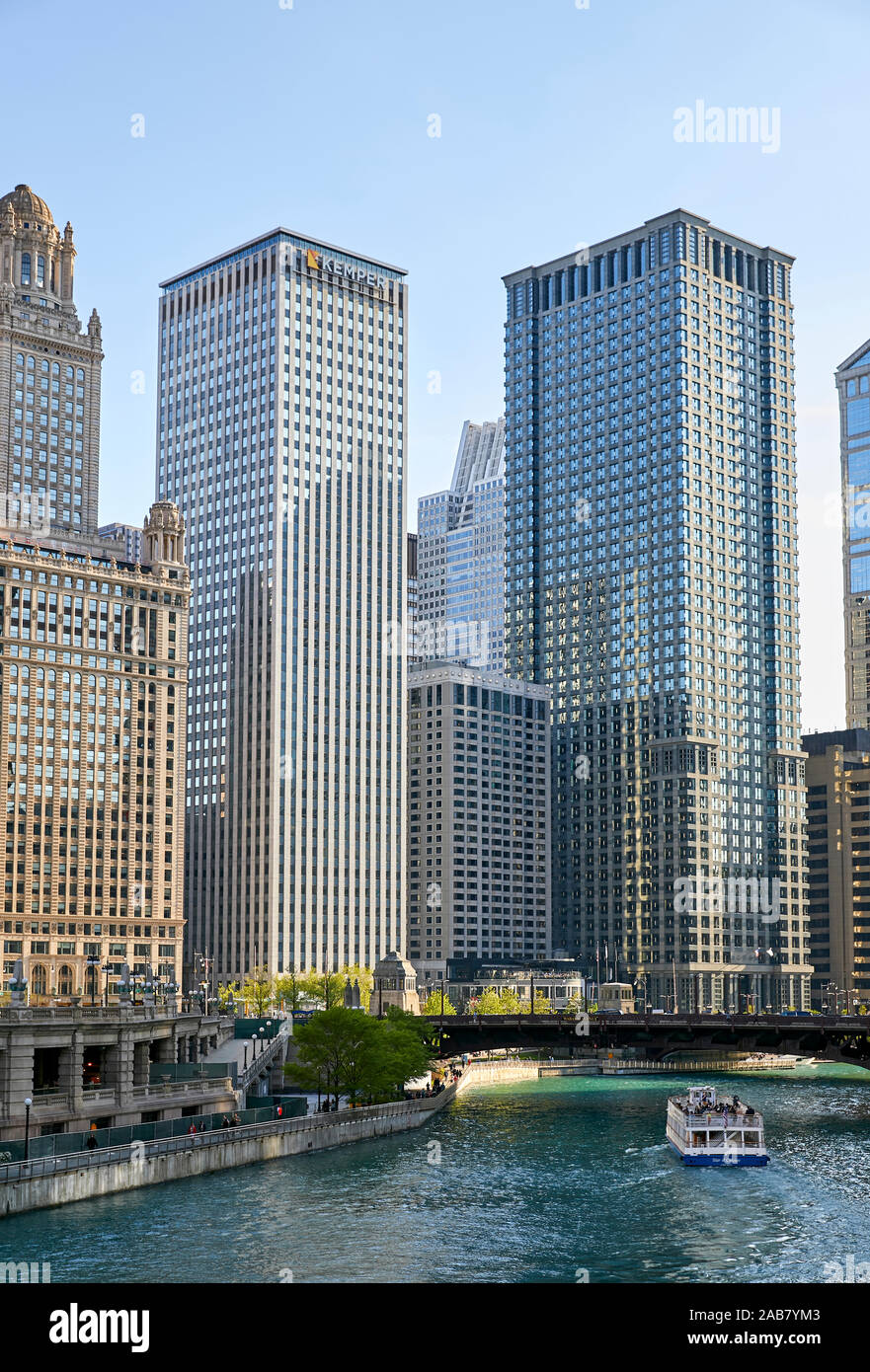 Downtown skyline and river cruise boat on the Chicago River near the Michigan Avenue Bridge, Chicago, Illinois, North America Stock Photo