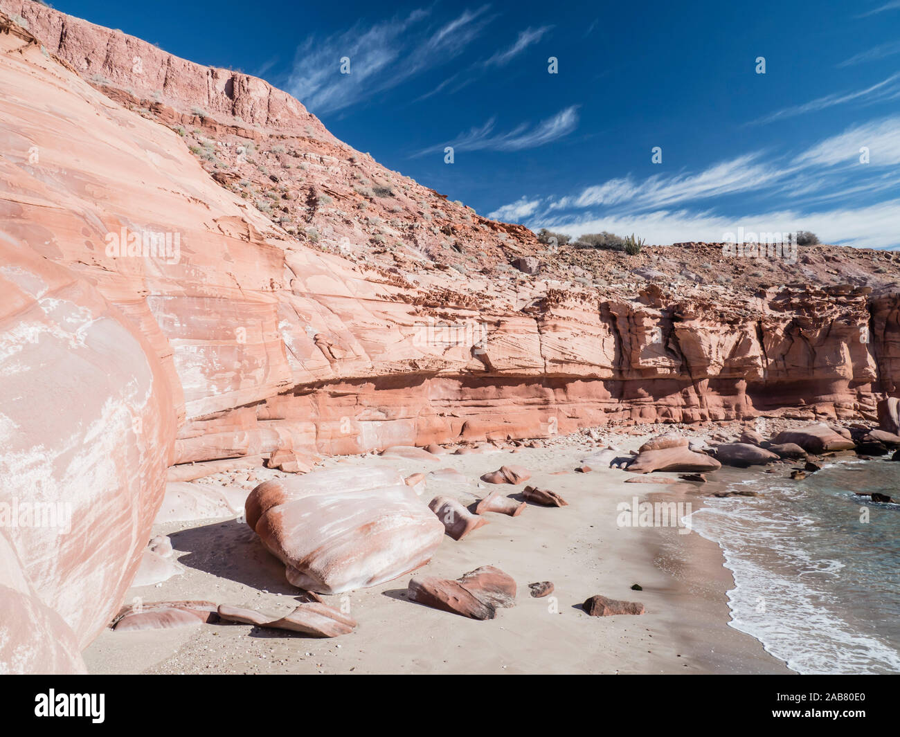 Red sandstone cliffs at Puerto Gato, Baja California Sur, Mexico, North America Stock Photo
