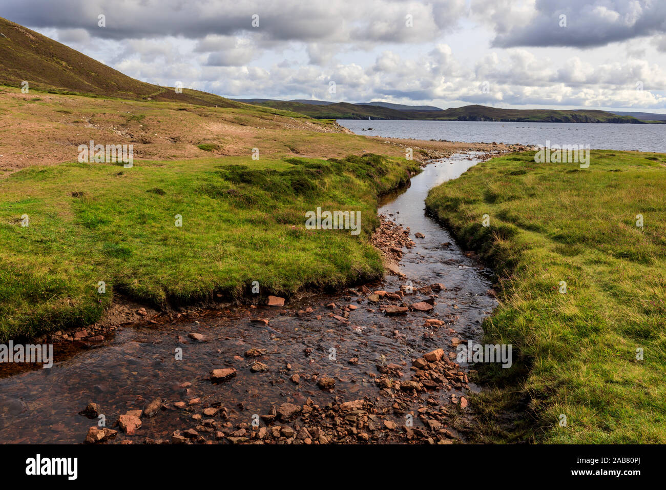 Little Ayre, burn, red sand and granite beach and rocks, Muckle Roe Island, Shetland Isles, Scotland, United Kingdom, Europe Stock Photo