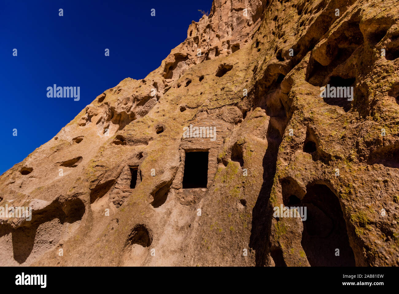 Cave dwellings on the Cliffside of Pueblo Indian Ruins in Bandelier National Monument, New Mexico, North America Stock Photo
