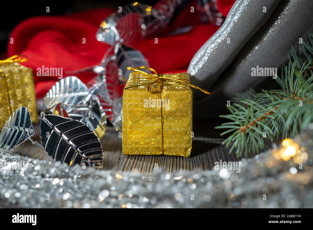 Festive Christmas Background With Golden Gift And Cone With A Pine