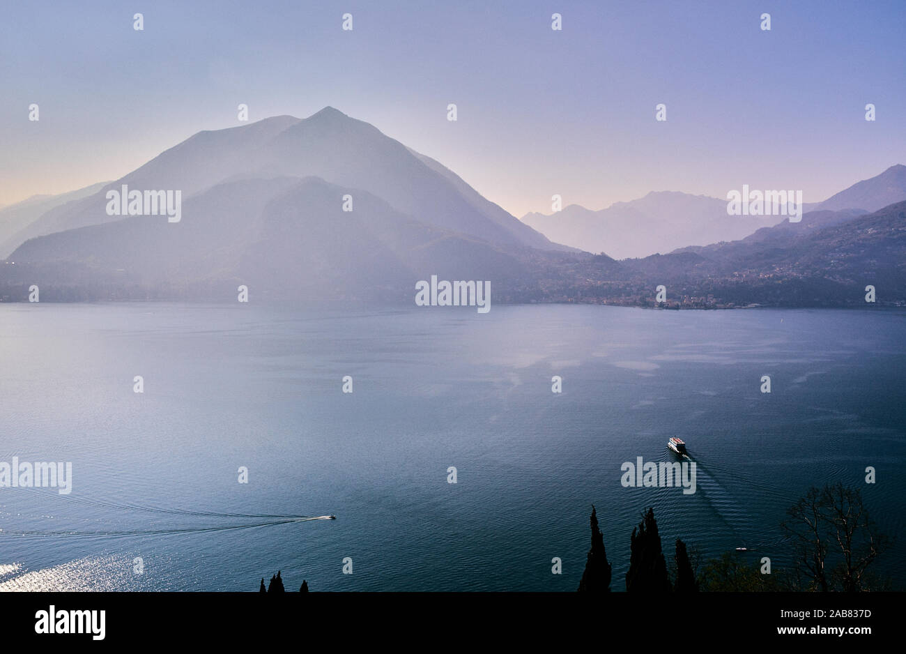 High angle view of Lake Como with a ferry boat travelling across the lake, Lombardy, Italian Lakes, Italy, Europe Stock Photo