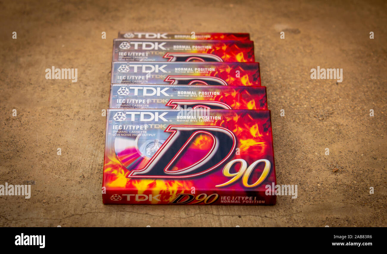 Salem, Tamil Nadu / India - November 24 2019 : Unopened TDK D90 audio cassettes laid down on a gray background Stock Photo