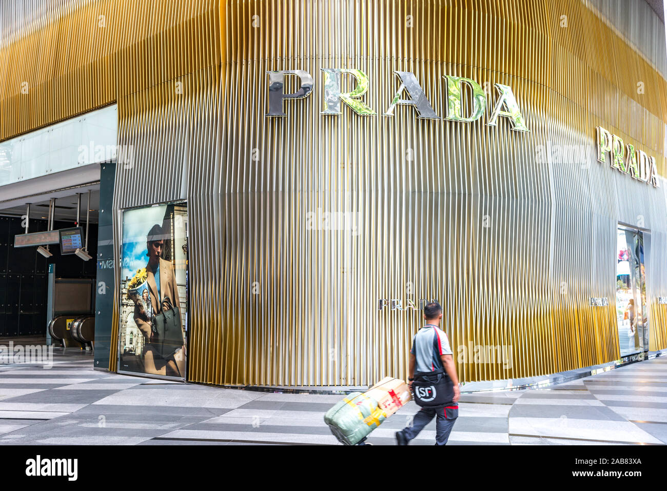 Prada store in new shopping mall. Prada S.p.A. is an Italian luxury fashion  house founded in 1913. One Asian delivery male can be seen Stock Photo -  Alamy