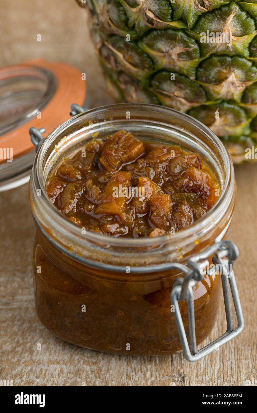 Glass jar with homemade pineapple chutney close up Stock Photo