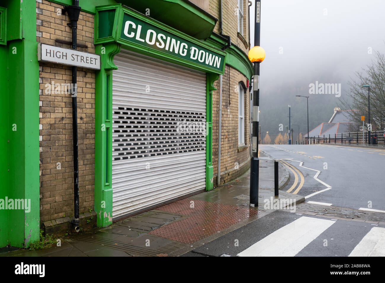 High Street Shops closing down with shutters closed, decline in