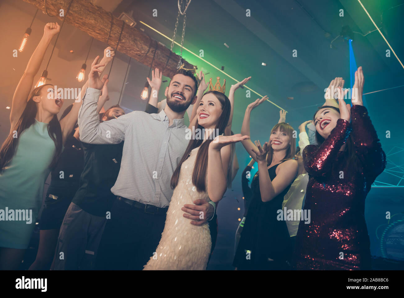 Nice attractive luxury stylish trendy gorgeous cheerful cheery glad company guys students having fun active social night life evening occasion at Stock Photo