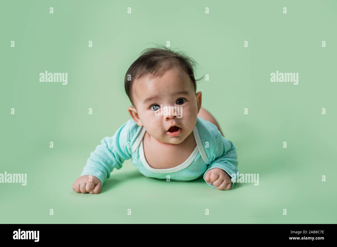 baby is on his stomach development Stock Photo