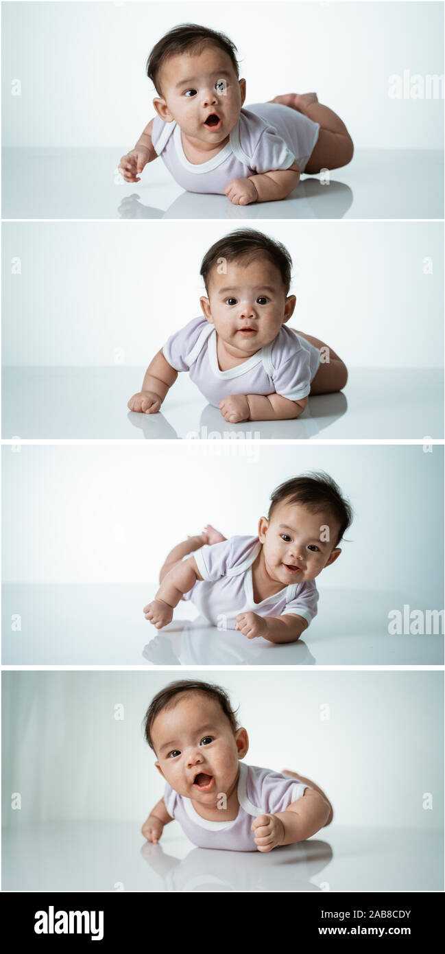 baby laying on her belly in studio Stock Photo Alamy