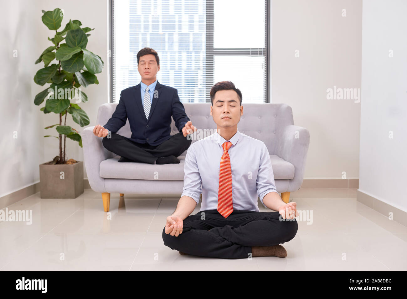 business people doing yoga in office Stock Photo - Alamy
