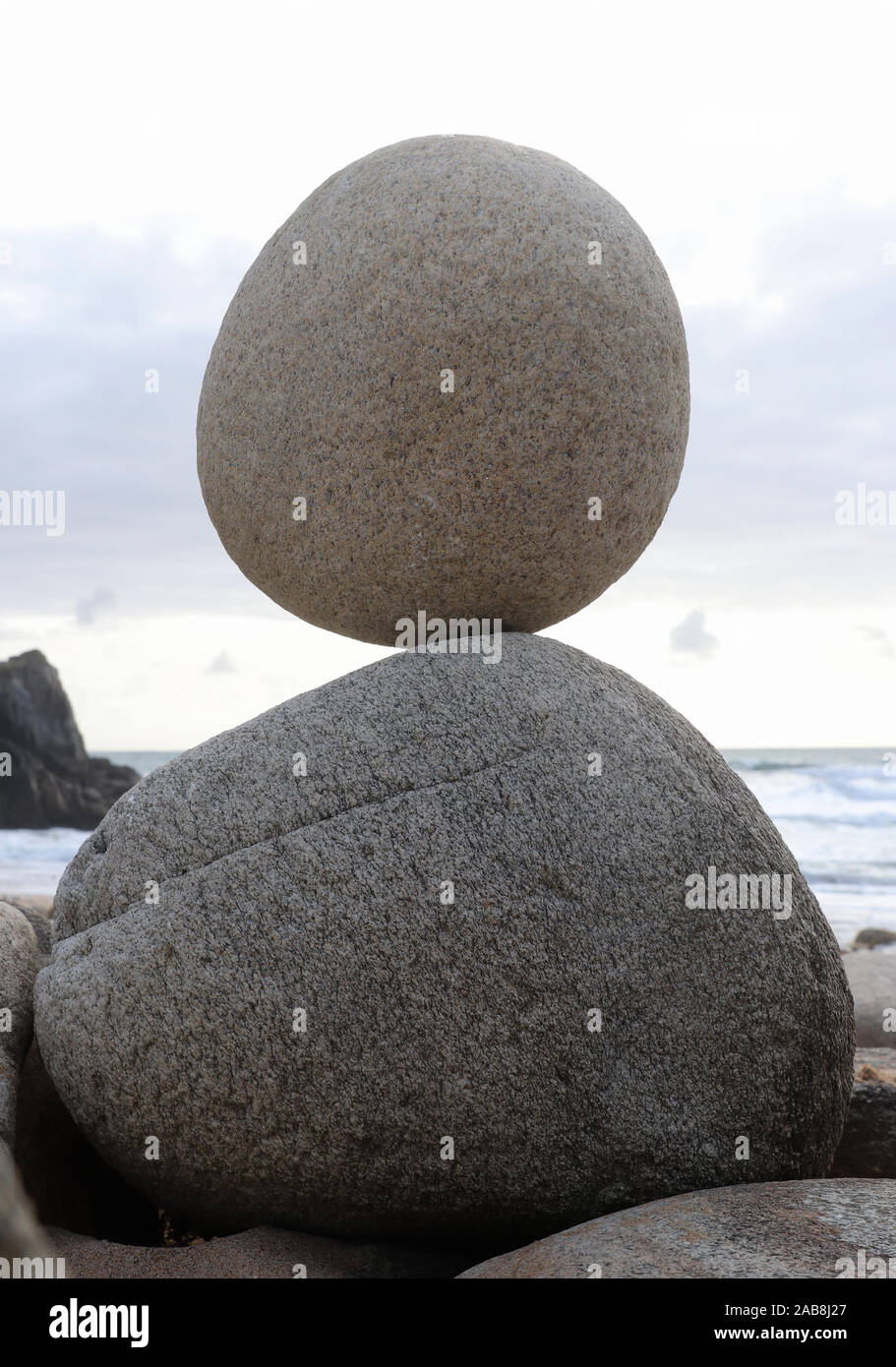 Stone pyramid - stone laid on other stone on seacoast Stock Photo