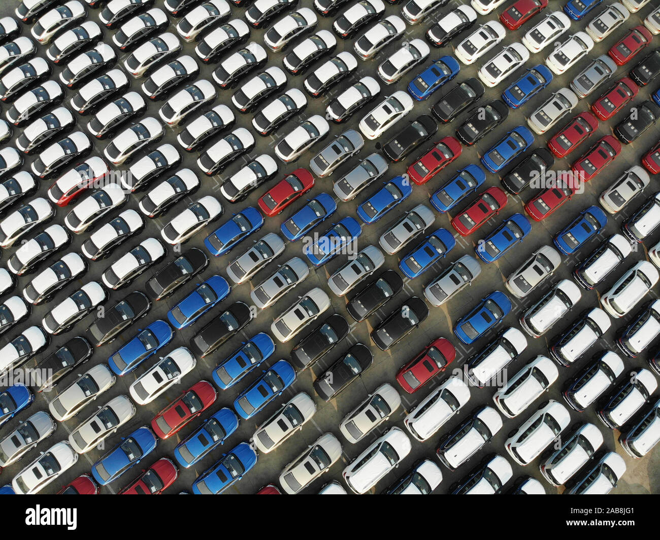Rows of Chinesemanufactured cars are lined up on the quay before being