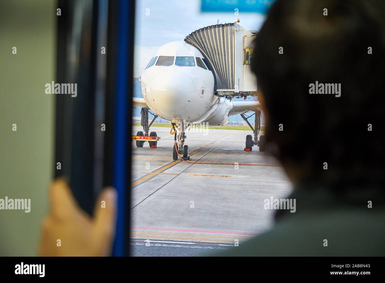 Passenger and plane, Bilbao Airport, Loiu, Bizkaia, Basque Country, Spain Stock Photo