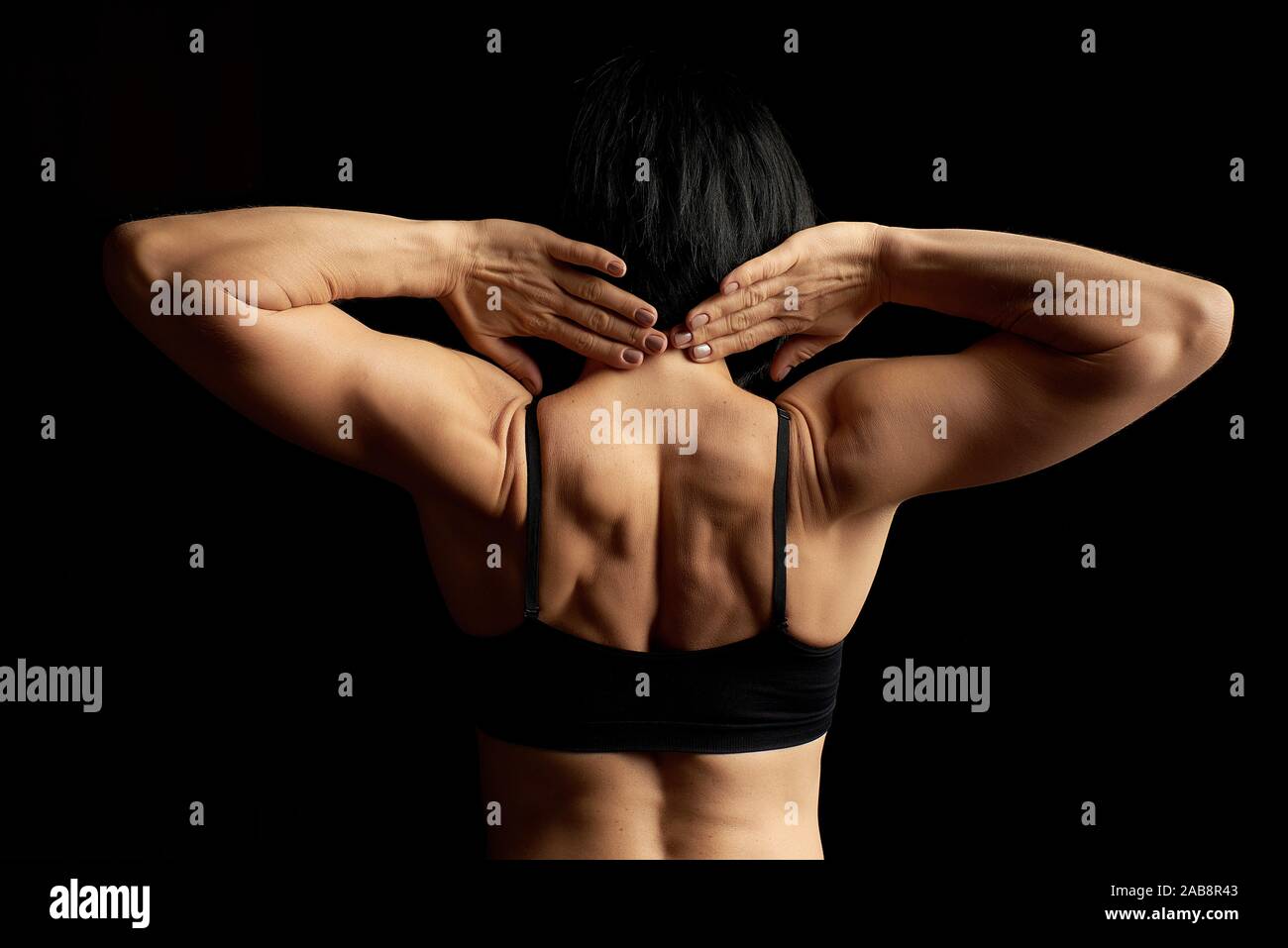 Athletic Young Woman Showing Muscles Of The Back Stock Photo