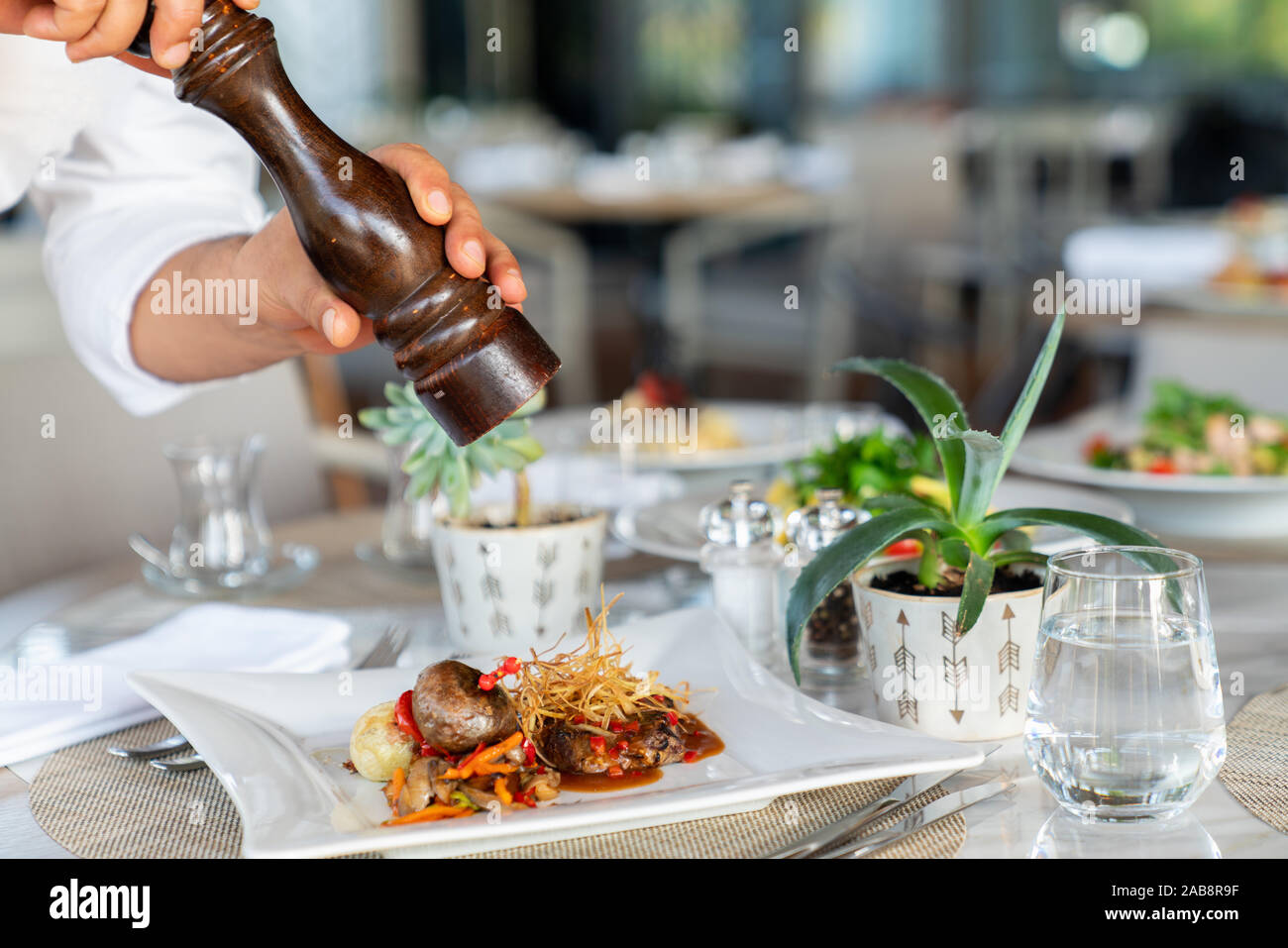 A delicious roasted beef with garnish is served in a elegance restaurant or hotel Stock Photo