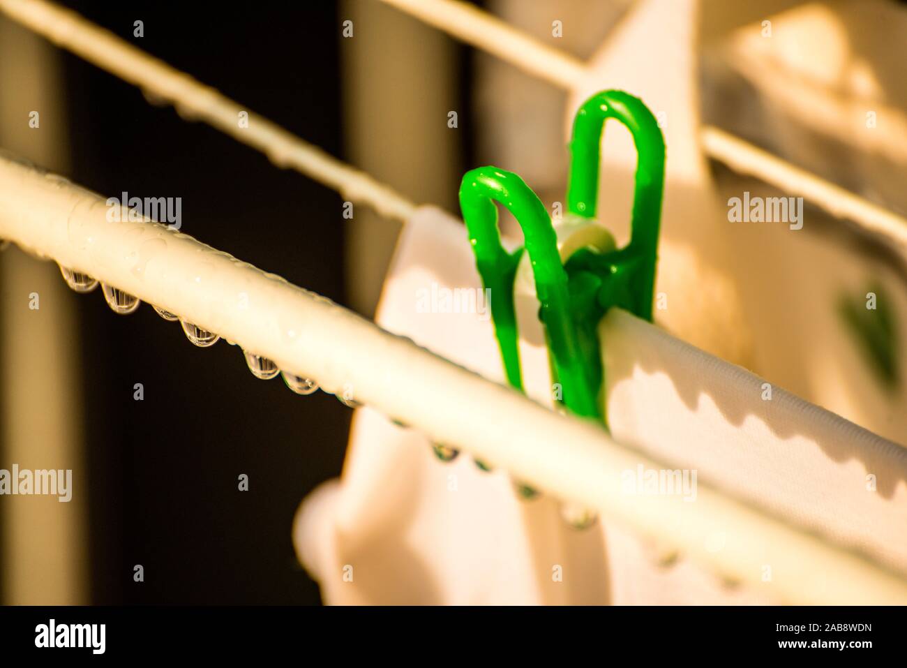 drying rack on a balcony with raindrops Stock Photo Alamy