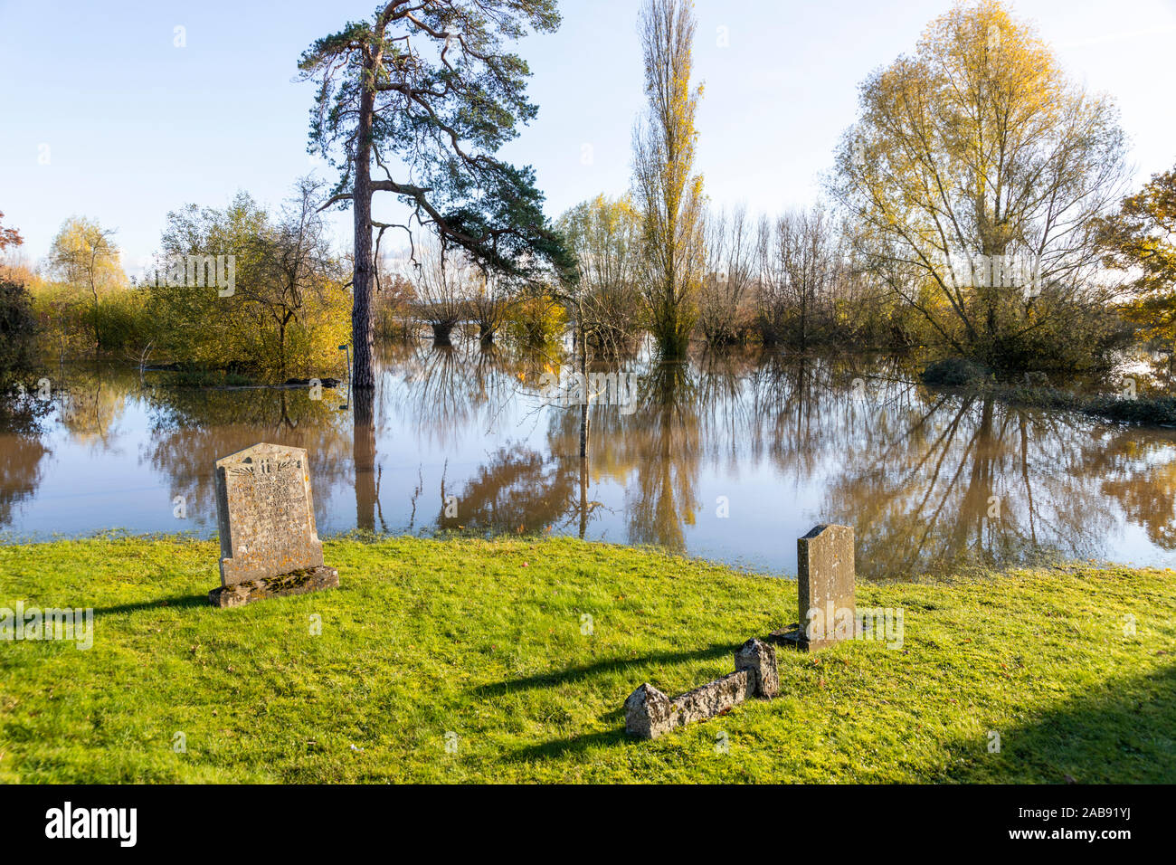 Floodwater from River Severn up to the churchyard of St John the Baptist church in the Severn Vale village of Chaceley, Gloucestershire UK 18/11/2019 Stock Photo