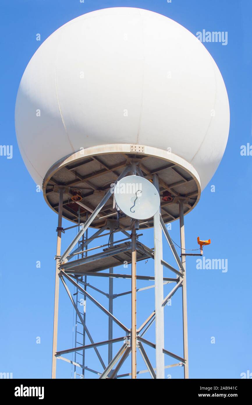 Meteorological radar station on the top of Sierra de Fuentes, Spain. Dome and tower over blue sky background. Stock Photo