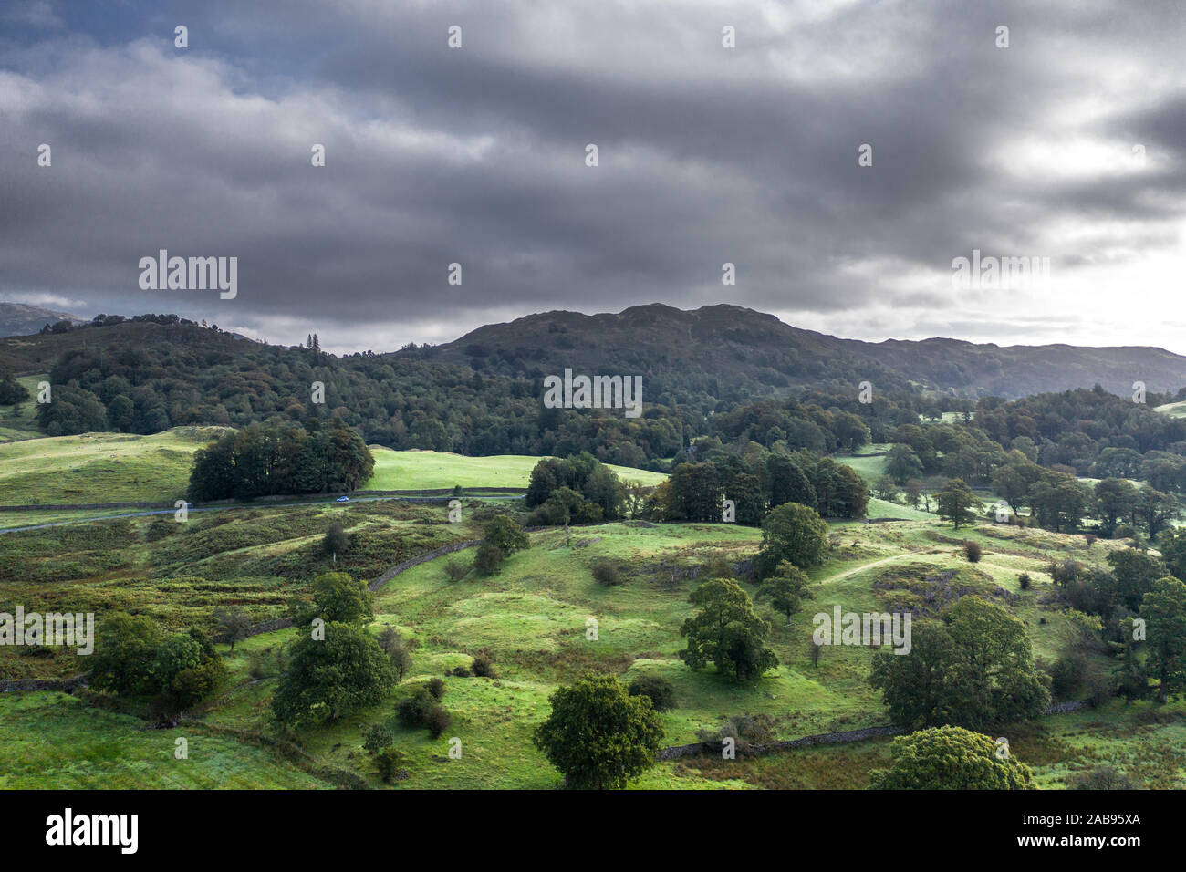 Drone shoot over Great Langdale valley at hazy morning in Lake District, UK Stock Photo