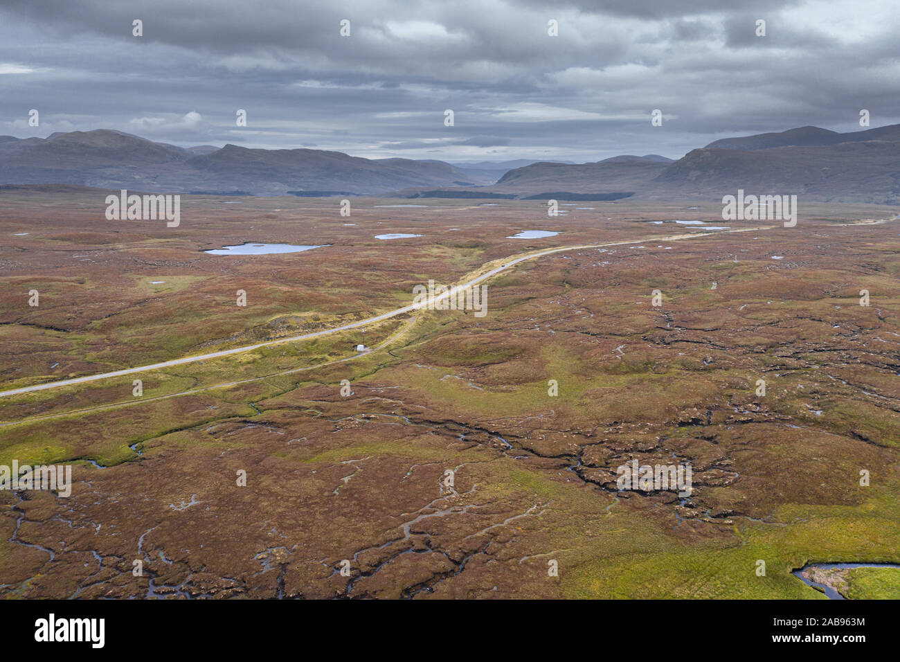 Aerial view over scenic wetland  across A832 road near Fairmore in the Northwest Highlands of Scotland - NC500 Route Stock Photo
