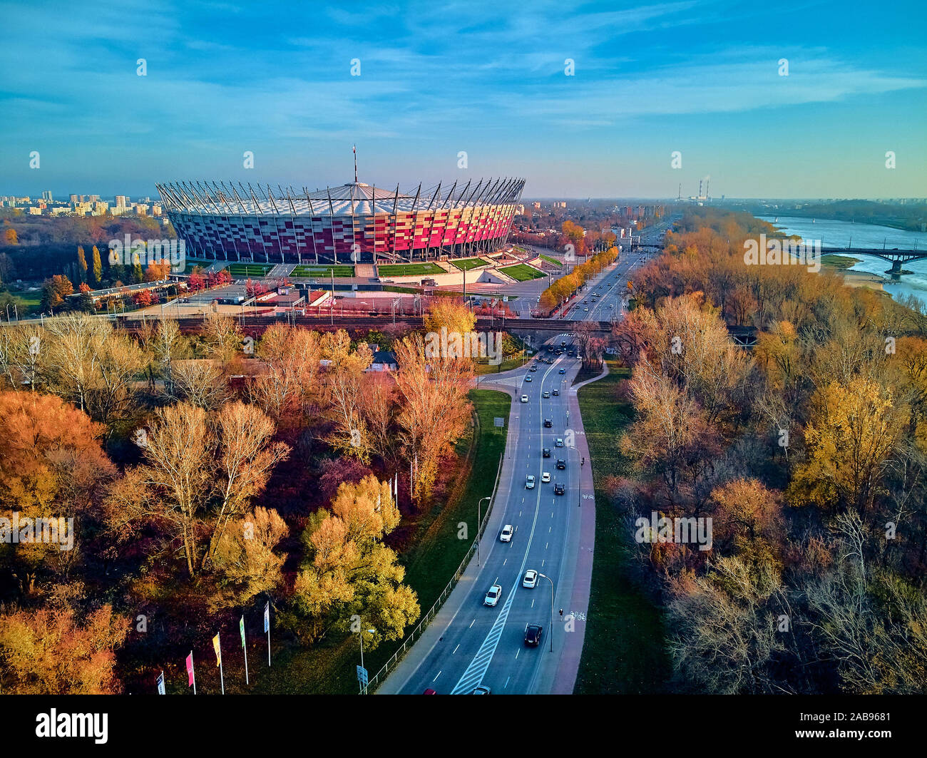 WARSAW, POLAND - NOVEMBER 17, 2019: Beautiful sunset panoramic aerial drone view to panorama of Warsaw modern City with skyscraper and The PGE Narodow Stock Photo