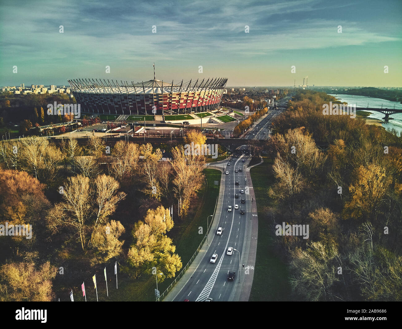 WARSAW, POLAND - NOVEMBER 17, 2019: Beautiful sunset panoramic aerial drone view to panorama of Warsaw modern City with skyscraper and The PGE Narodow Stock Photo