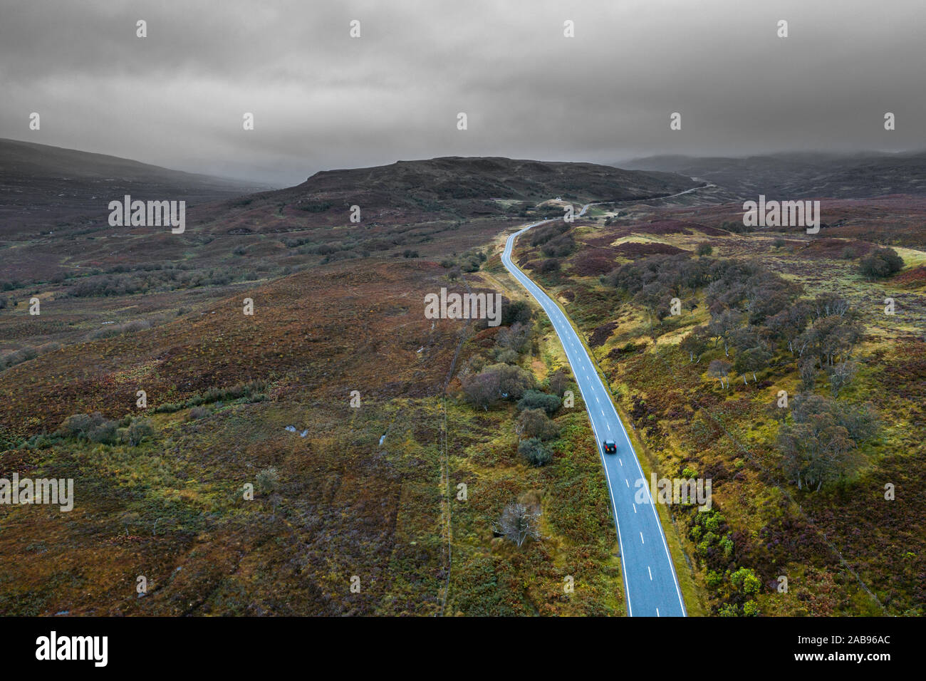 Drone shoot at autumn over scenic A835 road along North Coast 500 Route in the Northwest Highlands of Scotland Stock Photo
