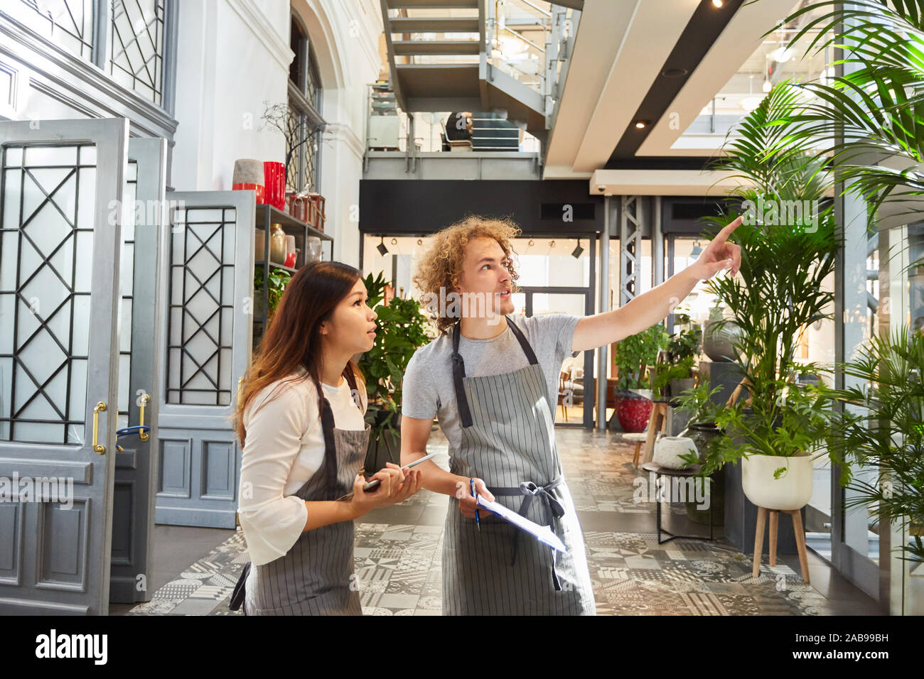 Florist team doing inventory in the garden center or flower shop Stock Photo