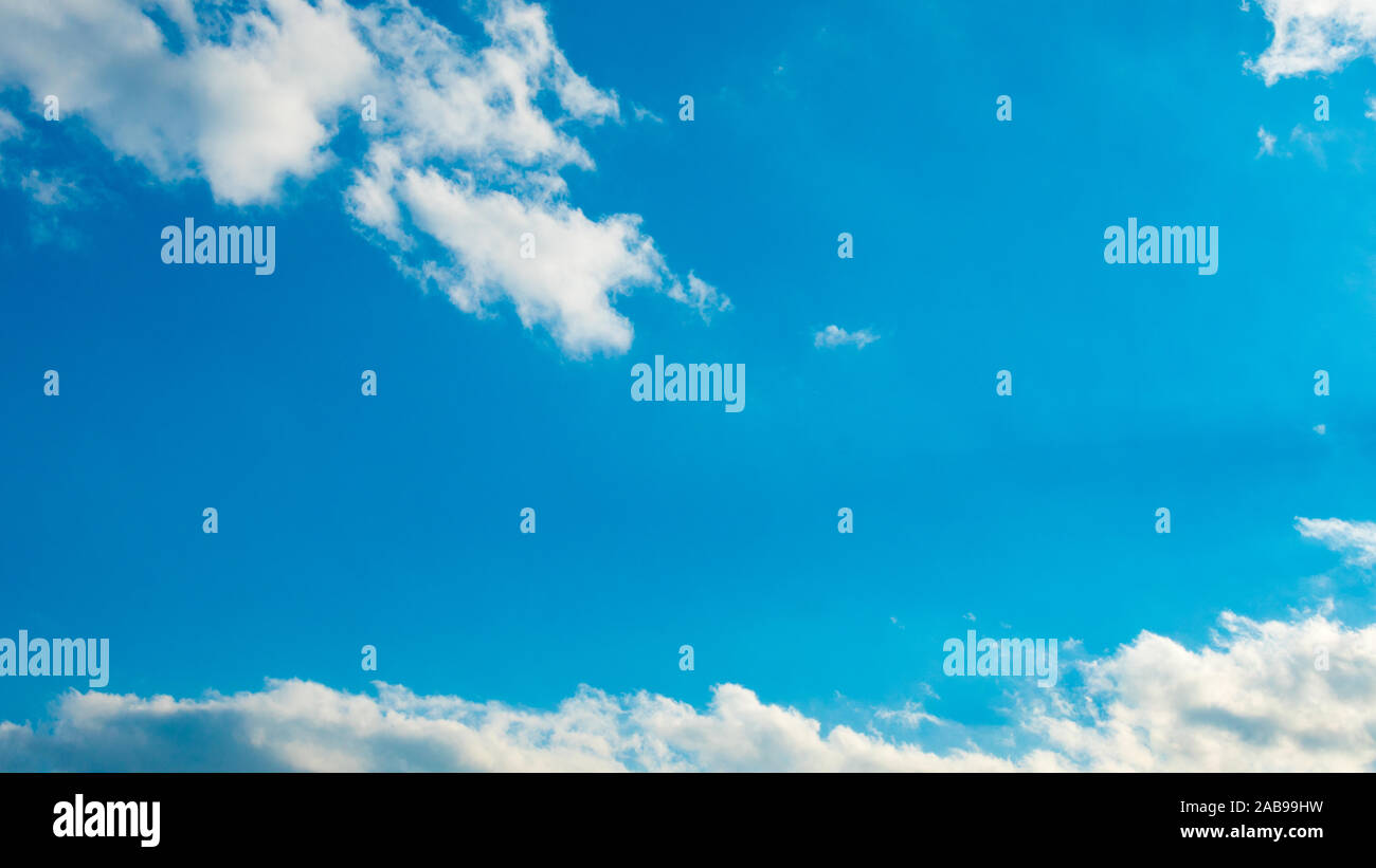 Lush blue sky with beautiful puffy white clouds Stock Photo - Alamy