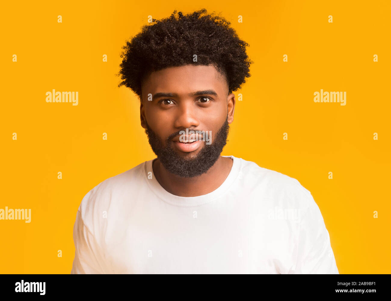 Young smiling african american man over orange background Stock Photo