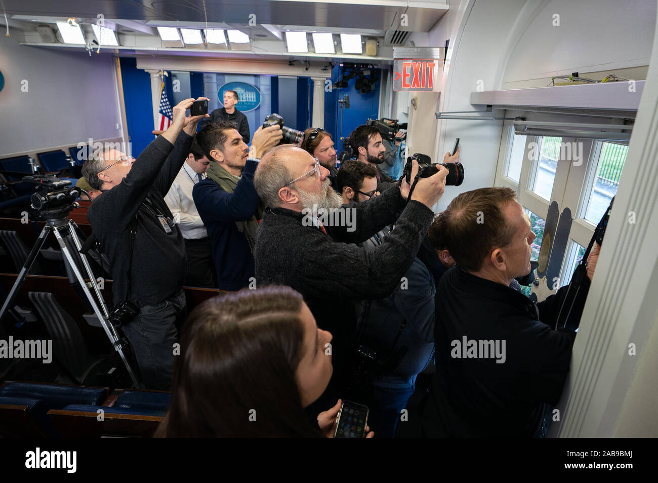Washington, United States. 26th Nov, 2019. Photographer take photos through a window in the briefing room as the White House is placed on lockdown after an aircraft violated secure airspace, in Washington, DC on November 26, 2019. Fighter jets were scrambled and a 30 minute lockdown was placed on the White House and Capitol following an airspace violation, according to law enforcement officials. Photo by Kevin Dietsch Credit: UPI/Alamy Live News Stock Photo