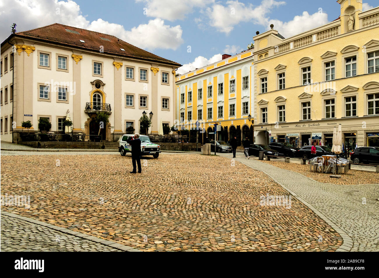 The main city square in Passau, Germany, with the Town Hall to the right Stock Photo