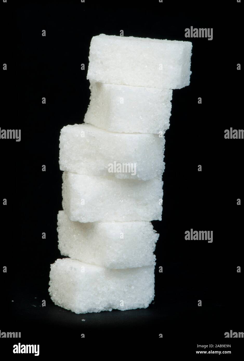 Sugar lumps black isolated. Studio shot Stock Photo - Alamy