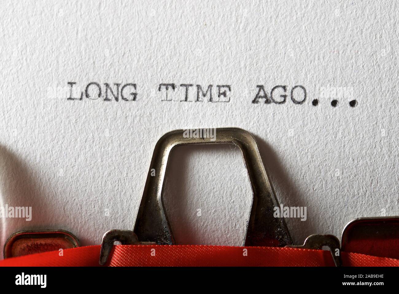 The sentence, long time ago, written with a typewriter. Stock Photo