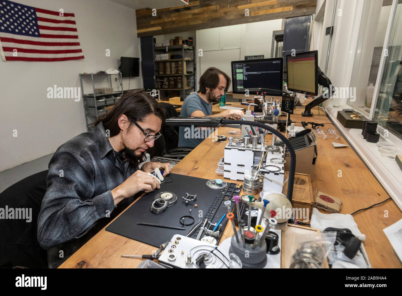 Fort Collins - Workers build watches at the Vortic Watch Company. The company salvages and restores antique pocket watches, making them into expensive Stock Photo