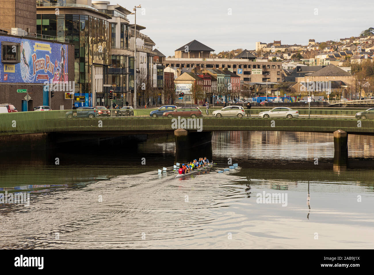 Rowing along the River Lee by St Patricks Quay in Cork City early morning, Ireland Stock Photo