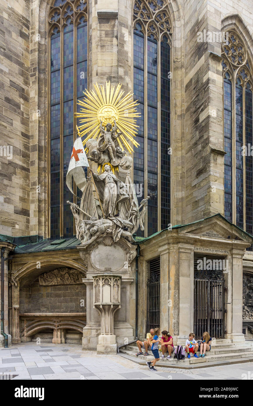 Sculpture group of saints with gilded circle of stars on Stephansdom, St. Stephen's Cathedral, Stephansplatz square, Vienna, Austria, Europe. Stock Photo