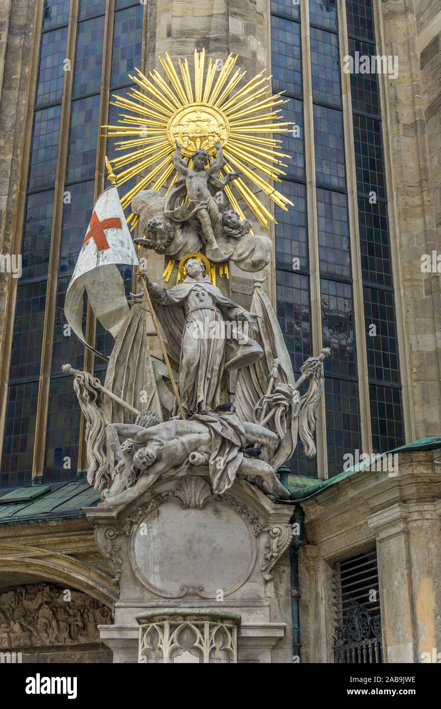 Sculpture group of saints with gilded circle of stars on Stephansdom, St. Stephen's Cathedral, Stephansplatz square, Vienna, Austria, Europe. Stock Photo
