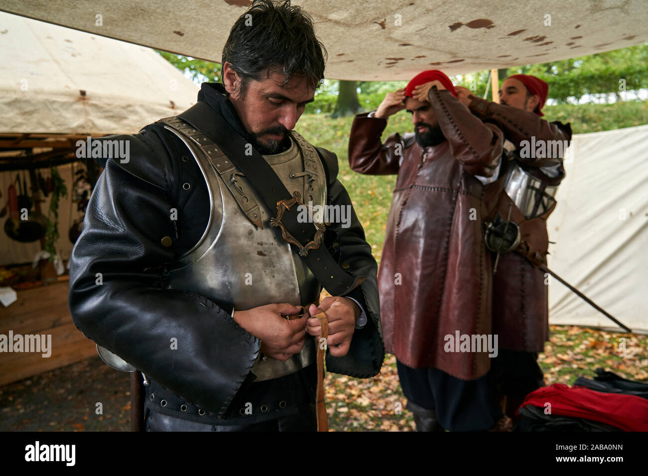 Participants of the event prepare their costumes of Spanish soldiers Stock Photo