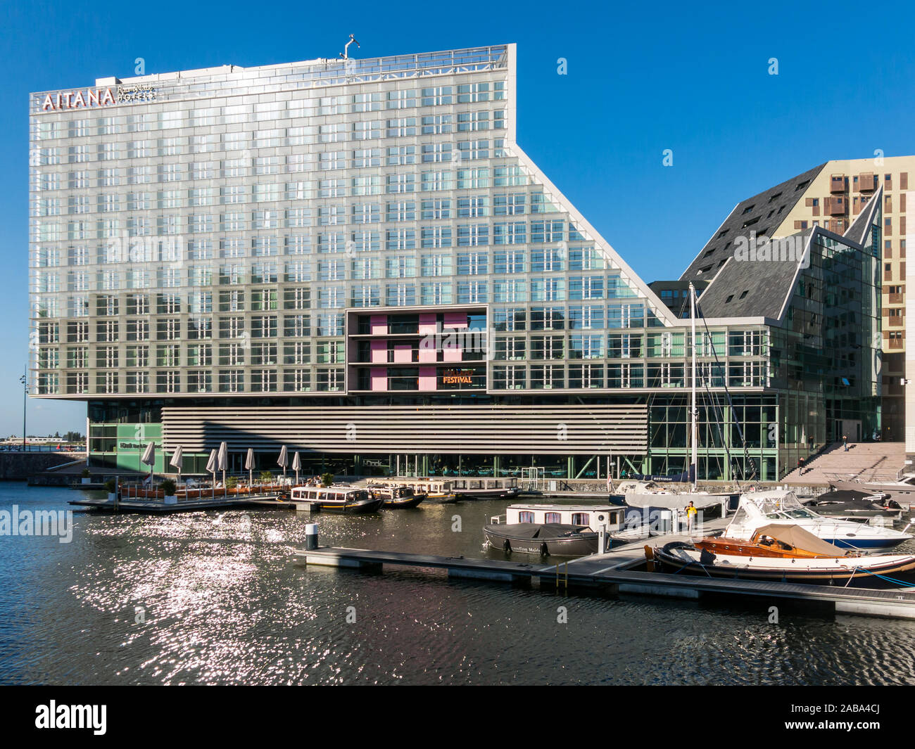 Hotel, restaurant and marina on IJdock peninsula in Amsterdam City, Netherlands Stock Photo