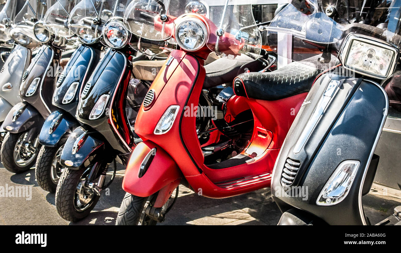 Row of new Italian motorcycles for sale in front of a shop in the Netherlands Stock Photo