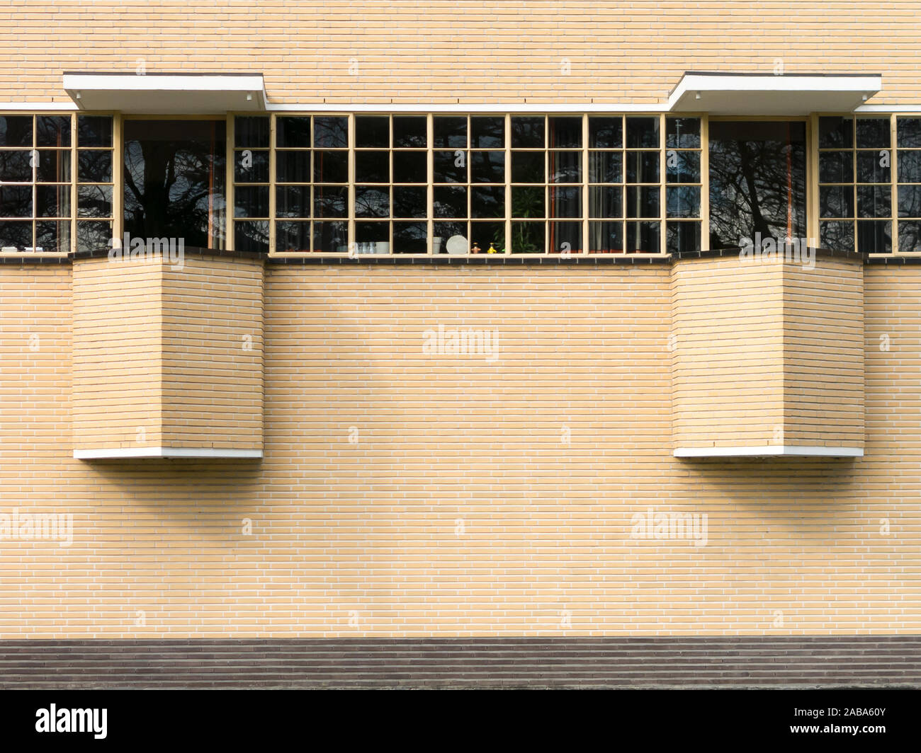 Detail of wall with windows of the Town Hall by Dudok in Hilversum, Netherlands Stock Photo